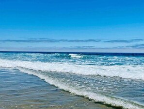 On the beach, sun-loungers, beach towels