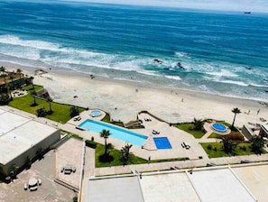 On the beach, sun loungers, beach towels
