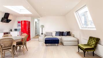 Basic Apartment, Multiple Beds | Living area | TV