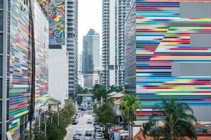 Urban streets come alive with vibrant architecture and lush greenery.