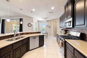 Fridge, microwave, oven, stovetop - Palms Place | Fairway Views + Pool & Spa | Pets OK (Indio)