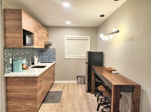 Fridge, microwave, stovetop, coffee/tea maker