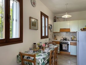 Microwave, oven, toaster, dining tables