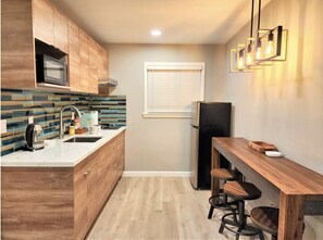 Fridge, microwave, stovetop, coffee/tea maker