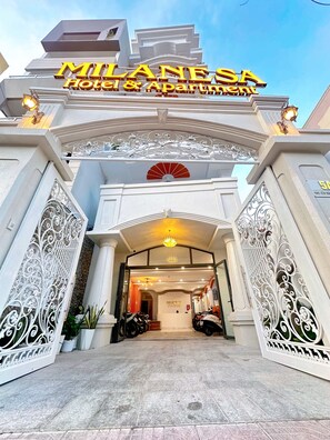 The entrance of Milanesia Hotel & Apartment with ornate white metalwork and a sign above the entrance. - Milanesa Hotel & Apartment (Ho Chi Minh City)