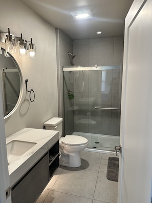 Shower, hair dryer, towels, soap