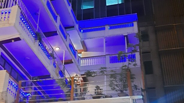 A hotel with a sign reading 'HOTEL SHREE TARA,' balconies with blue lighting, and a modern building facade. - Hotel Shree Tara (Kathmandu)