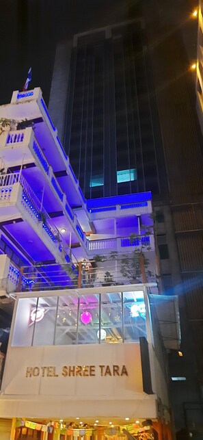 A hotel with a sign reading 'HOTEL SHREE TARA,' balconies with blue lighting, and a modern building facade. - Hotel Shree Tara (Kathmandu)