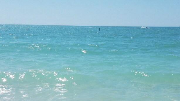 A beach with clear turquoise water and white sand. - PLACE TO BE we have everything you need  (North Port)