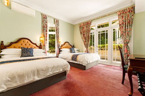 Family Quadruple Room | Minibar, in-room safe, individually decorated, individually furnished