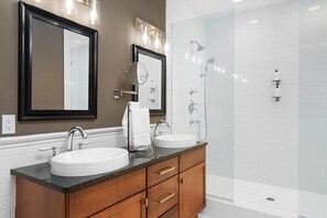 Shower, hair dryer, towels, shampoo