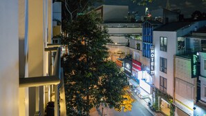 A hotel with a modern design, located at a street intersection.
