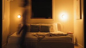 A bedroom with a bed, bedside lamps, and a window. - Teakettle-Modern-Close To Glacier, Skiing (Columbia Falls)