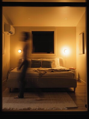 A bedroom with a bed, bedside lamps, and a window. - Teakettle-Modern-Close To Glacier, Skiing (Columbia Falls)