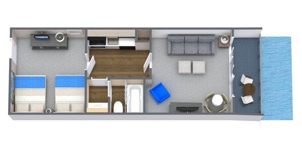 A floor plan of a hotel room with a kitchenette, a bathroom, a seating area with a view of the sea, and a small table.