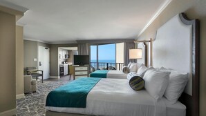 A hotel room with two beds, a desk, a television, and a view of the ocean. - Accessible Comfort with Ocean Views 6th Floor (Myrtle Beach)
