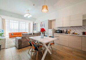 Enjoy meals in the dining area with a sofa and comfortable seating.