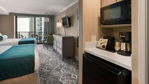 A hotel room with two beds, a desk, a television, a microwave, and a coffee maker.