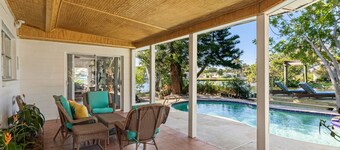 Coconut cove - peaceful garden retreat with HEATED pool on canal near the beach!