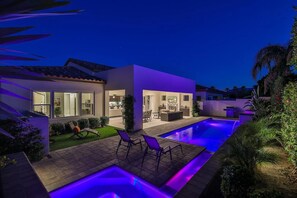 A modern house with a swimming pool, patio furniture, and a well-maintained garden. - CIT03 - 4bd/3.5ba, 3020 sf - Private Entertainer's Dream! (La Quinta)