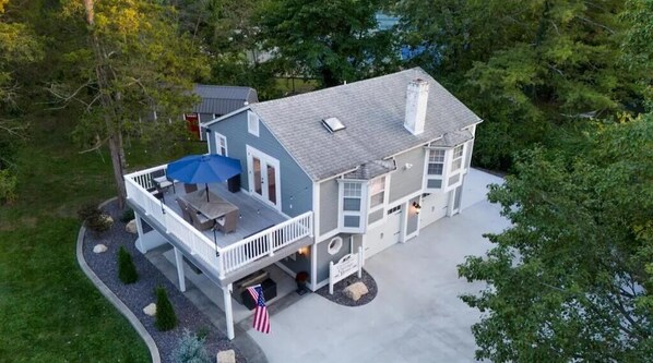 A two-story house with a covered porch and a small deck. - Your home away from home in downtown, historic Farmington! (Farmington)