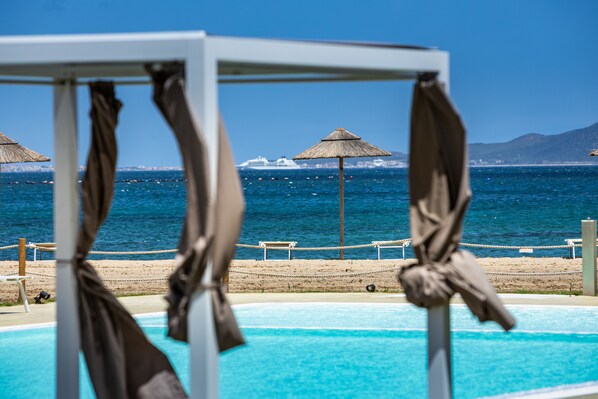 Outdoor pool, open 8:00 AM to 8:00 PM, pool umbrellas, pool loungers