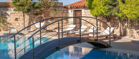 Outdoor pool, open 8:00 AM to 8:00 PM, pool umbrellas, pool loungers