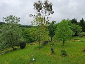 A grassy field with trees and a fence. - Country House "Domaine Baraque" with Mountain View, Wi-Fi, and Air Conditioning (Pouillon)