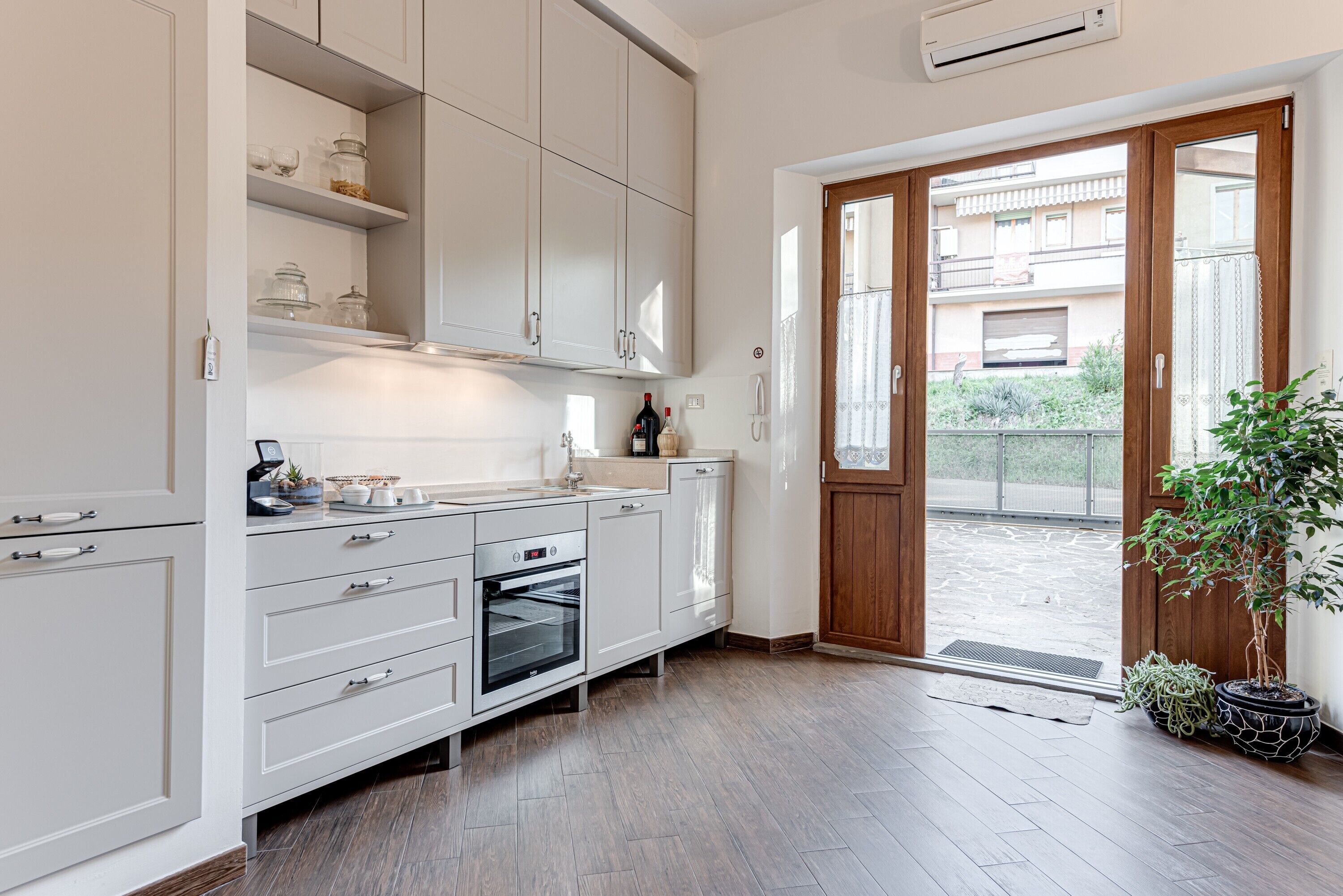 Fridge, stovetop, dishwasher, coffee/tea maker