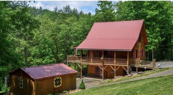 Beside the Still Waters- side of log cabin.