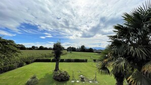 A well-maintained lawn with a few trees and a clear sky. - CHEZ LABAT 2 - ESPOEY (ESPOEY)