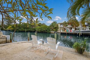 Property grounds - Canal Walk: Tiki Bar, Mini Golf, Pool & Spa On Canal by Anna Maria Life Vacation Rentals (Anna Maria)
