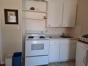 Family Room | Private kitchen | Full-size fridge, microwave, coffee/tea maker, electric kettle - Three Islands Motel (Kawartha Lakes)