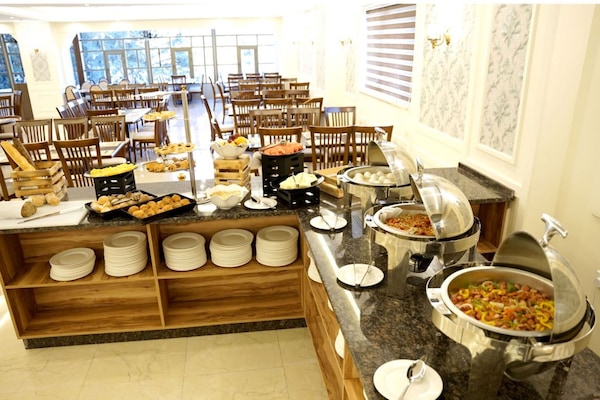 Daily buffet breakfast (USD 10 per person)
