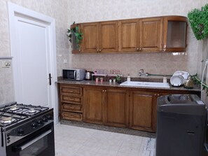 Deluxe Apartment | Private kitchen | Full-size fridge, microwave, oven, stovetop - Royal Apartment in Talaat Harb Downtown (Cairo)