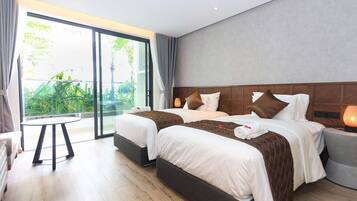 Family Twin Room | Minibar, in-room safe, laptop workspace, free WiFi