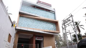 A building with a sign for 'Shree Jayaganga Arcade'.