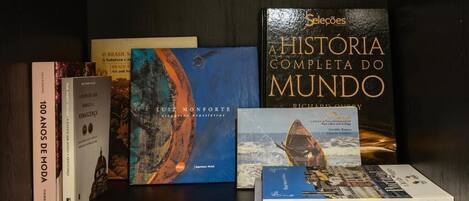 A collection of books on a shelf.
