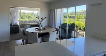 Private setting with vineyard outlook yet only moments from the Village.