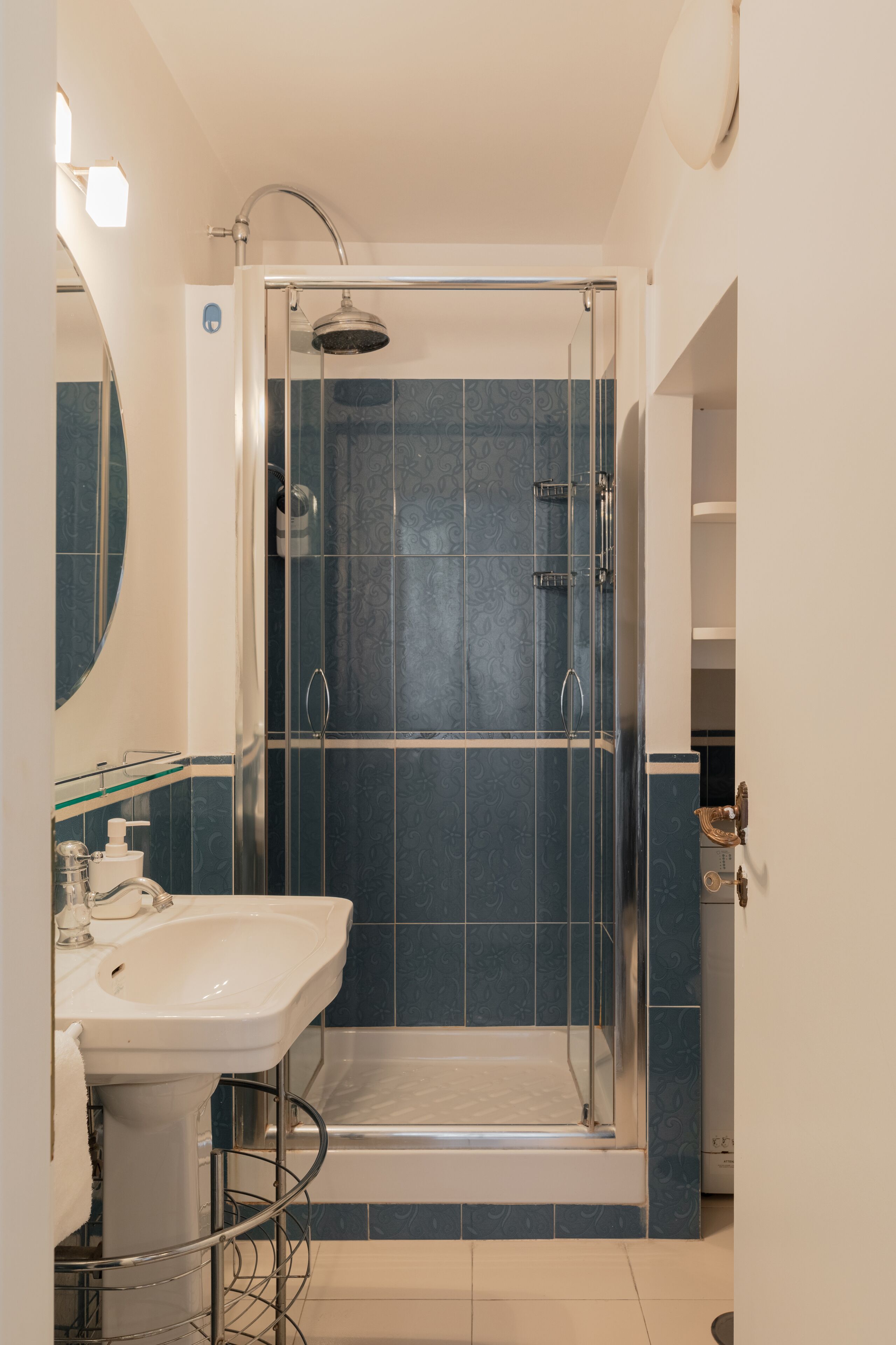 Shower, rainfall showerhead, hair dryer, towels