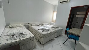 A hotel room with two single beds, a small table, and a chair. - Hotel Mangabeiras Express (Maceió)