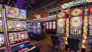 A casino with multiple slot machines and a large wheel of fortune game. - Luxury Full House in Dorado, Puerto Rico (Dorado)