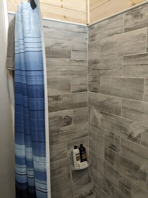 Shower, hair dryer, towels, toilet paper