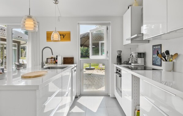 Fridge, stovetop, dishwasher, coffee/tea maker