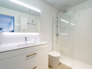 Shower, hair dryer, towels, toilet paper