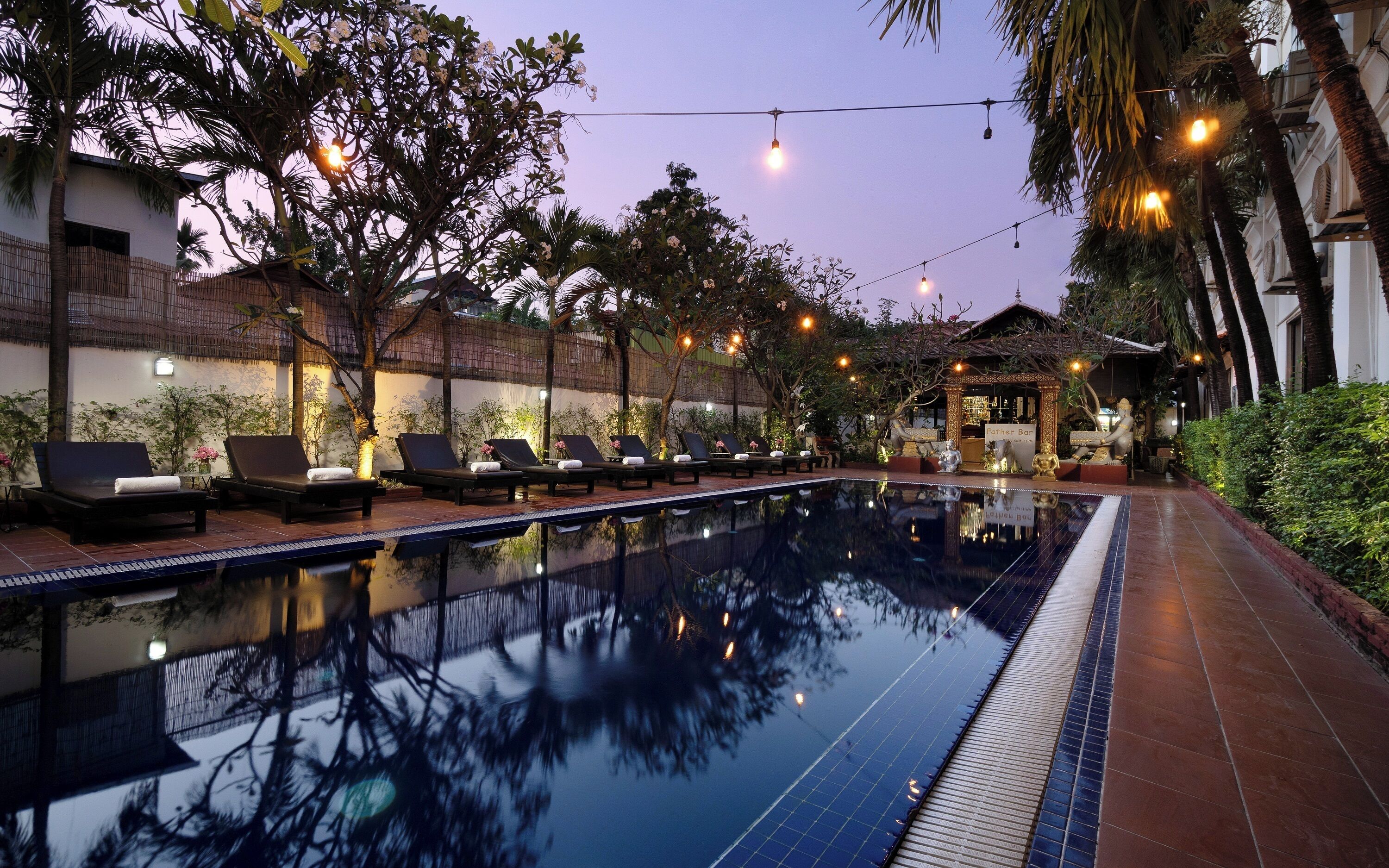 Outdoor pool, open 9:00 AM to 9:00 PM, pool loungers