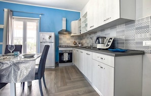 Fridge, microwave, stovetop, cookware/dishes/utensils
