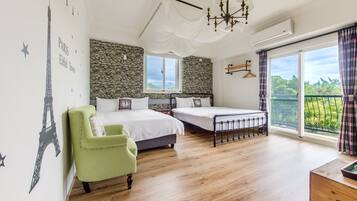 A bedroom with a stone wall, a bed, a chair, a balcony with curtains, and a view of greenery.
