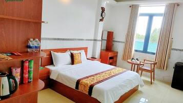 Desk, blackout drapes, iron/ironing board