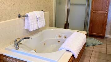 Jetted bath, hair dryer, towels, soap